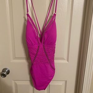 Bright pink deep plunge swimsuit with lace edging